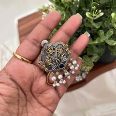 Vriksham Dual-Tone Oxidized Silver and Gold Floral With Sapphire Blue Stone and Pearl Hangings Dual-Tone Oxidized Silver and Gold Floral Stud Earrings with Sapphire Blue Stone and Pearl Hangings-S1113